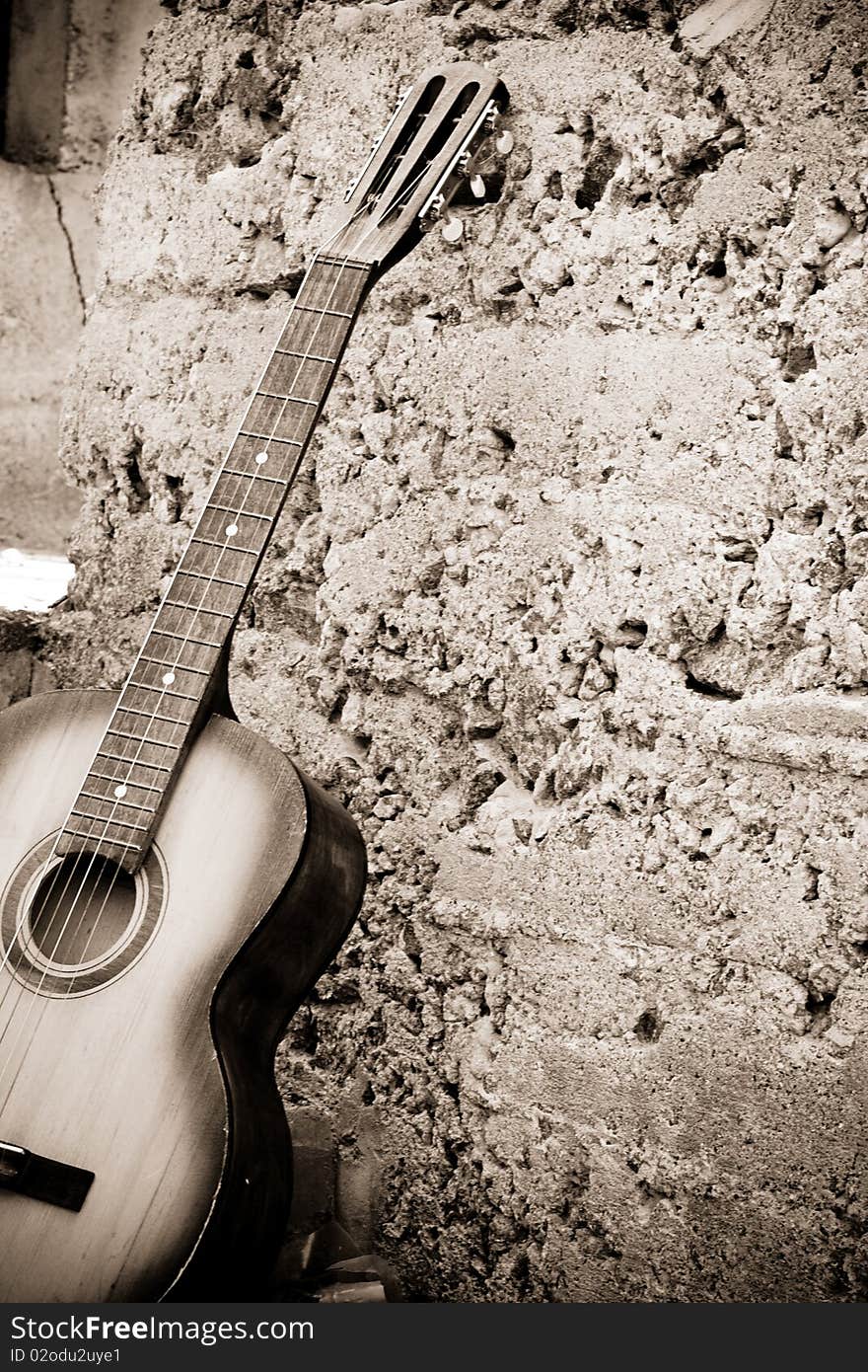 Sepia image of guitar near steps. Sepia image of guitar near steps