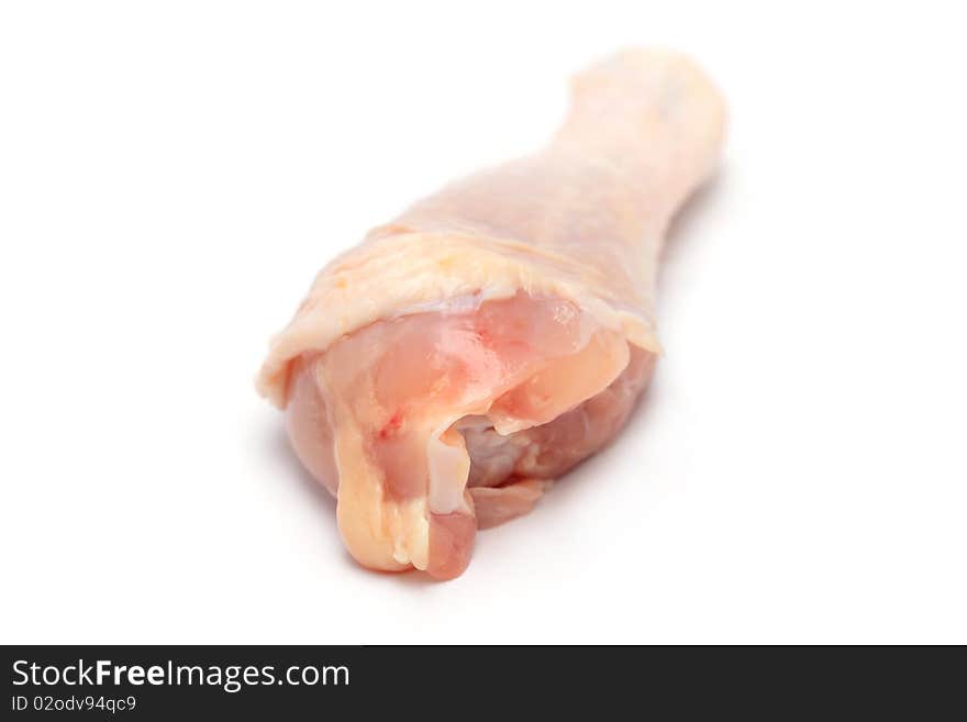 Close up of a raw chicken drumsticks isolated on white background.