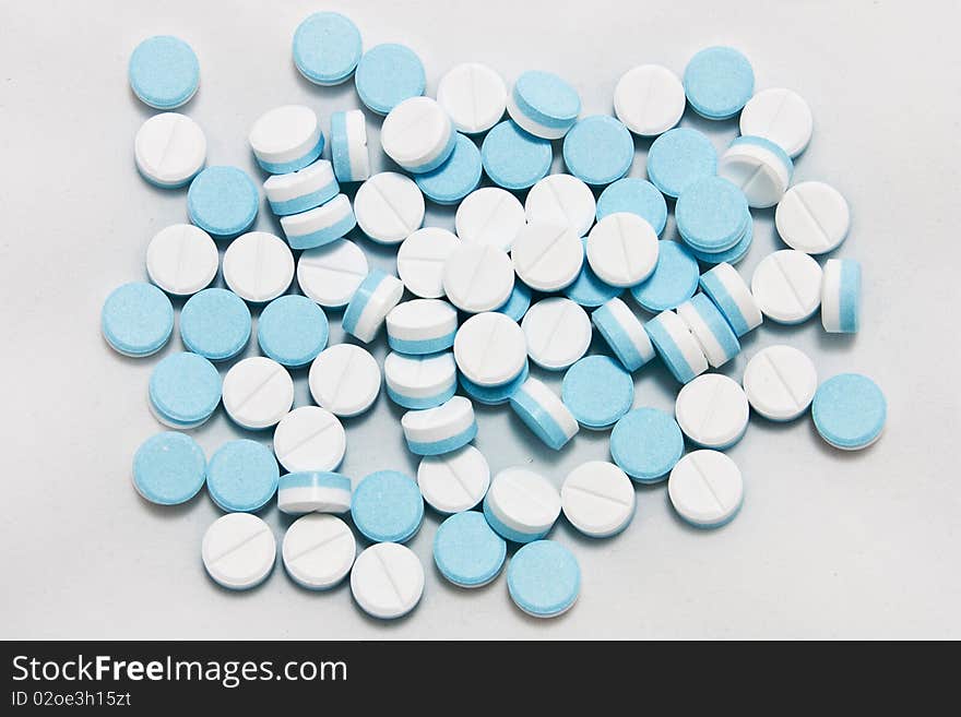 White and blue paracetamol tablets. White and blue paracetamol tablets