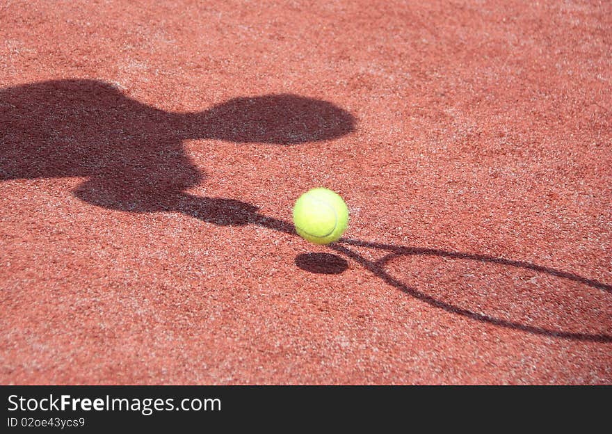 Shadow of the player, when he plays in tennis. Shadow of the player, when he plays in tennis