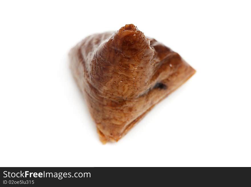 Close up of a rice unwrapped dumpling over white background. Close up of a rice unwrapped dumpling over white background.