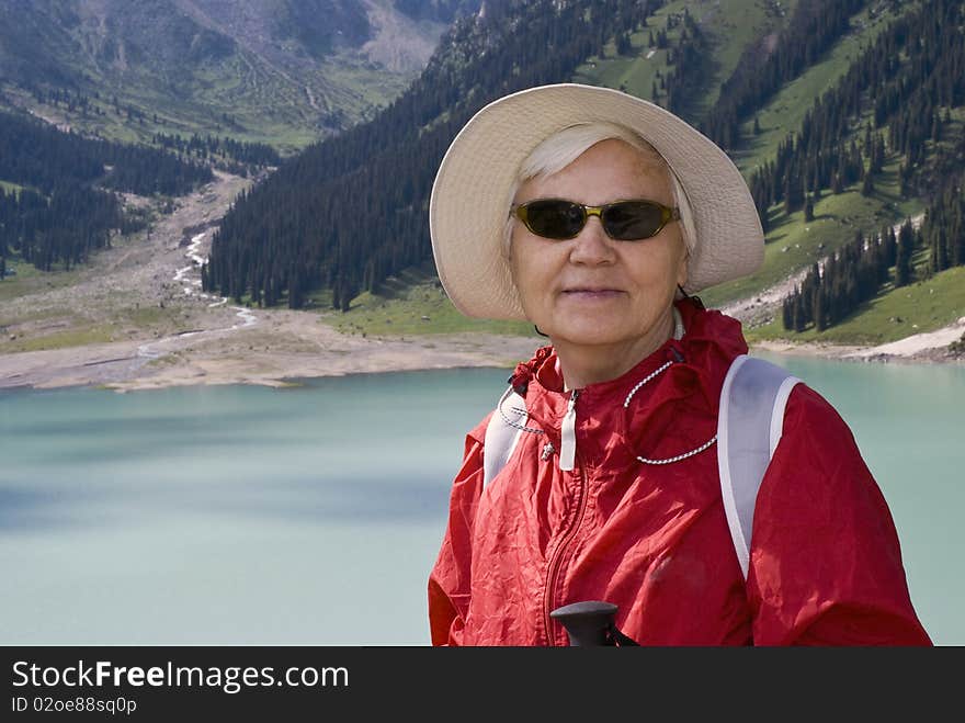 Old women with mountains flowers. Old women with mountains flowers