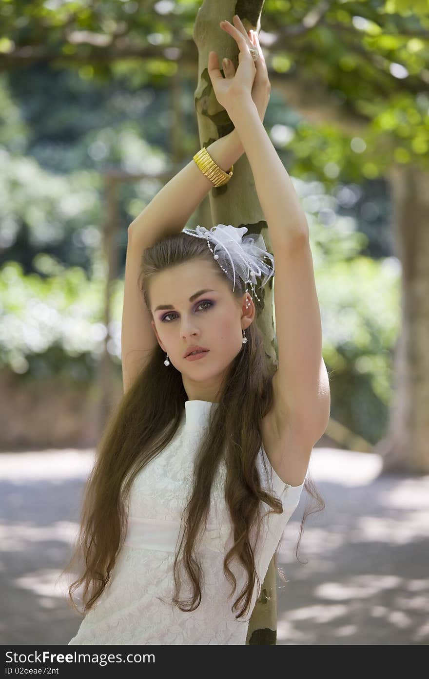 Young bride at tree