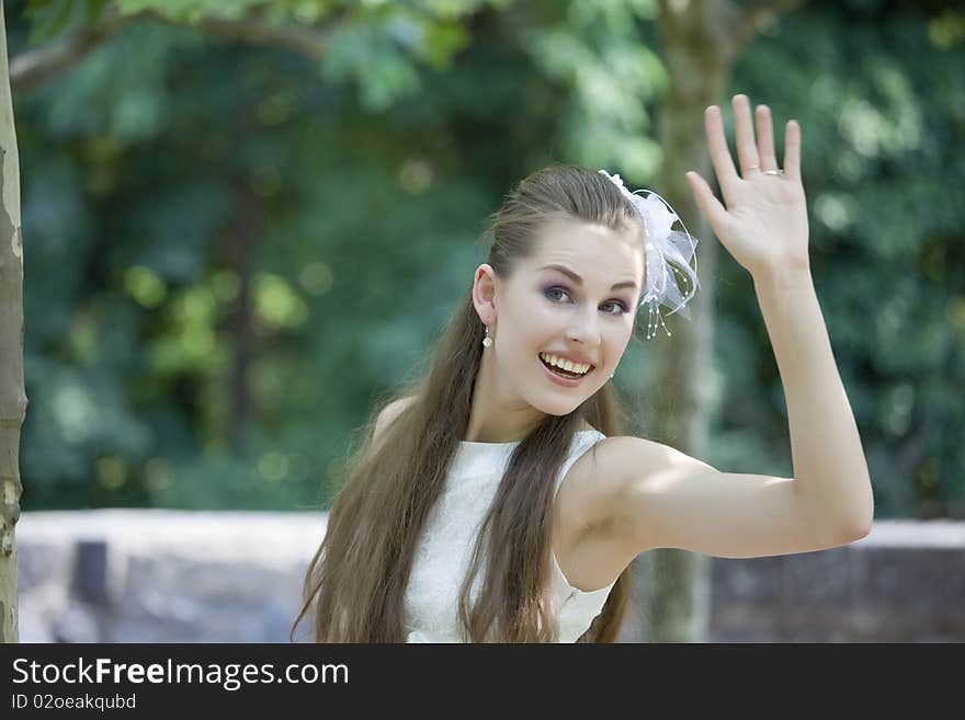 Young happy bride waving with hand. Young happy bride waving with hand