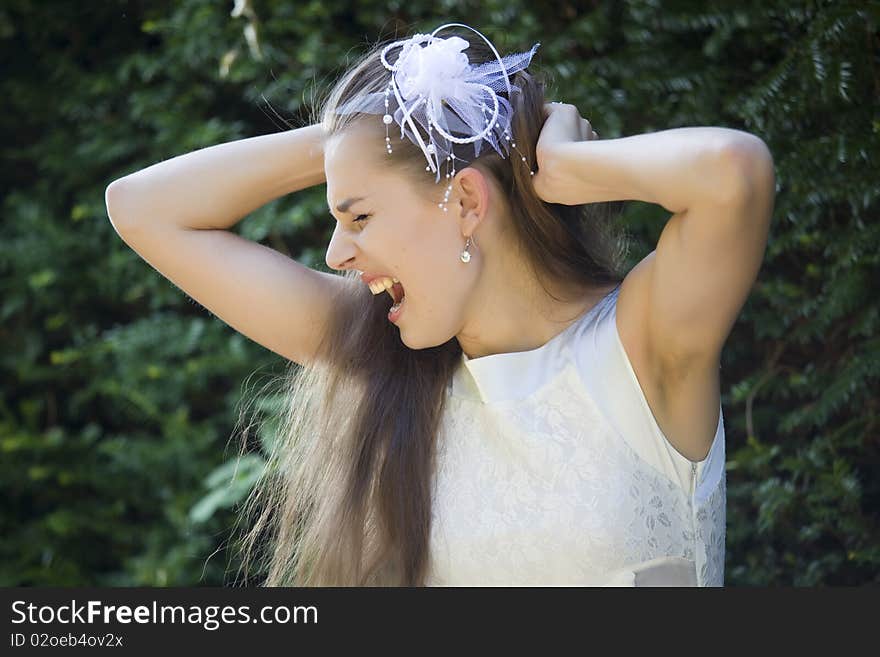 Angry bride crying and pulling hair on her head. Angry bride crying and pulling hair on her head