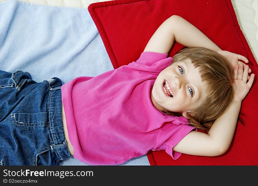 Little Girl  Resting On Bed