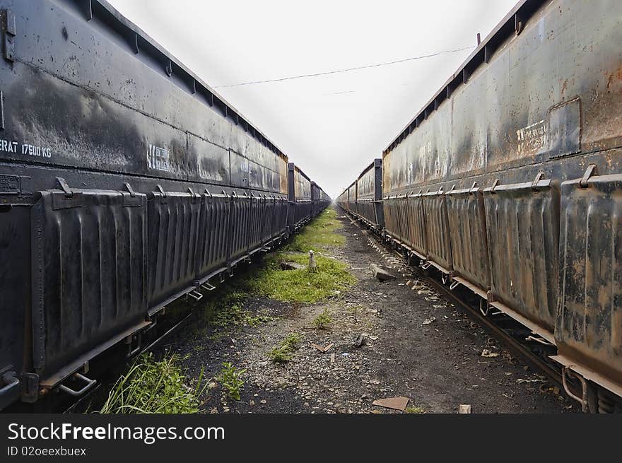 Black iron train car, parking on train depot