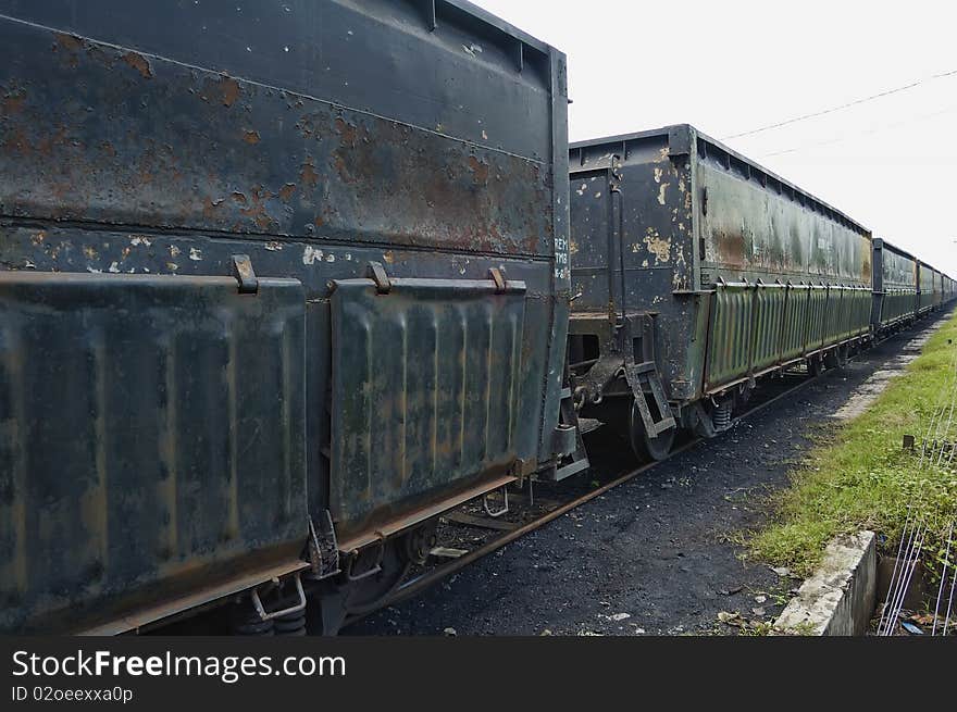 Black iron train car, parking on train depot