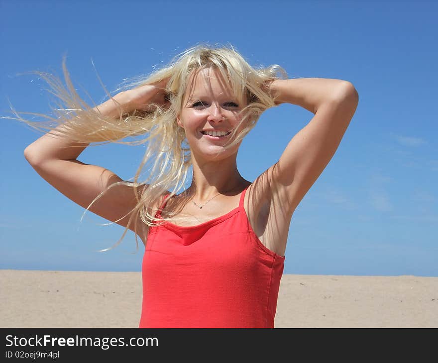 Woman at beach on blue sky