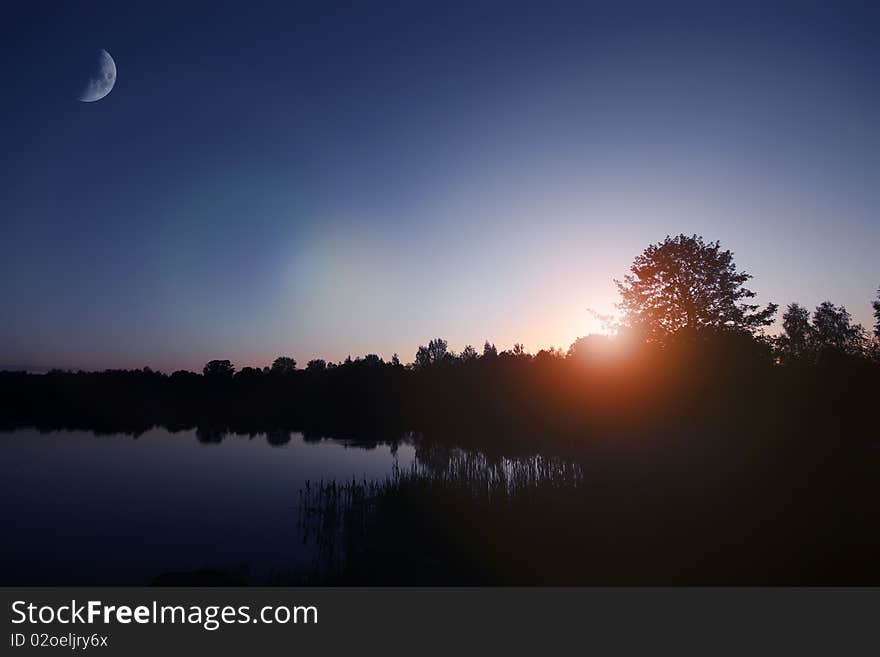 Sun rise lake, early morning, moon and sun. Sun rise lake, early morning, moon and sun