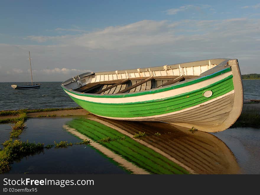 Boat ashore against the sea