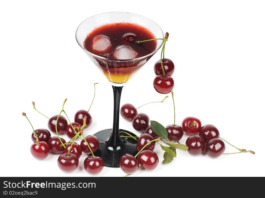 Cocktail with ice and fresh cherries, it is isolated on a white background.