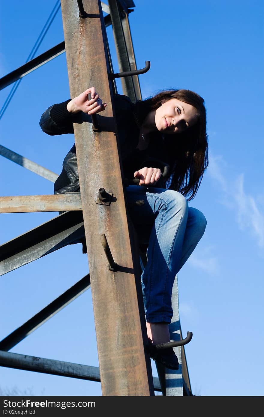 Woman on electrical tower