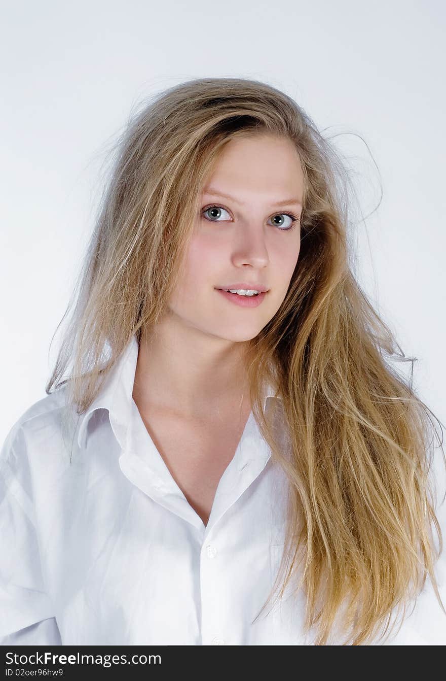 Portrait of an attractive young woman with shaggy hair. Portrait of an attractive young woman with shaggy hair