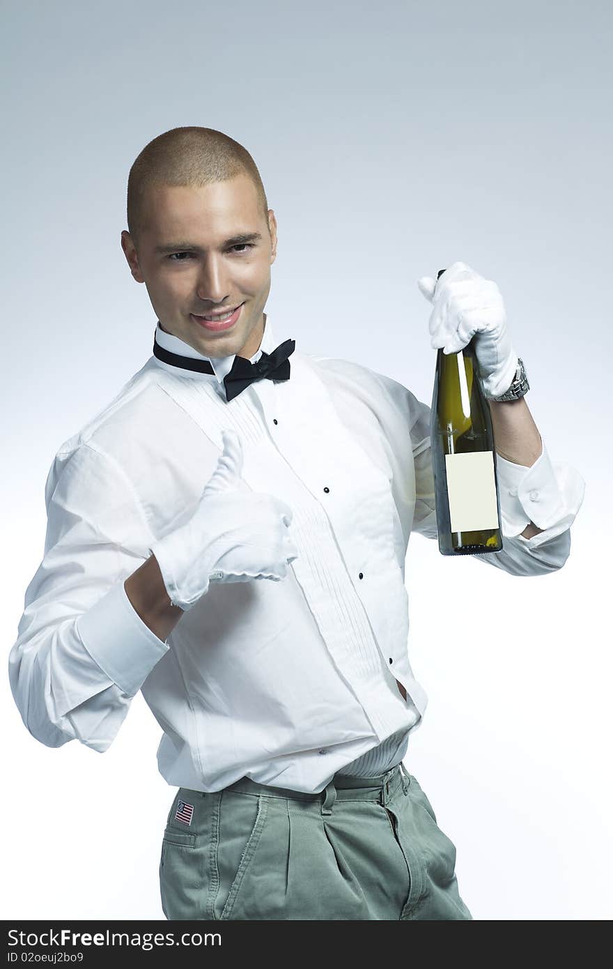 Cool wine waiter holding a bottle of white wine. Cool wine waiter holding a bottle of white wine