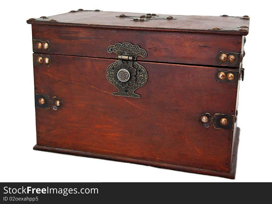 An old wooden jewelery box with metal buckle on a white background