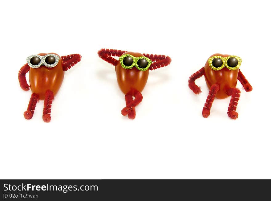 Italian Rosa Tomatoes, wearing sunglasses, comically symbolic of sun-dried tomatoes. Italian Rosa Tomatoes, wearing sunglasses, comically symbolic of sun-dried tomatoes