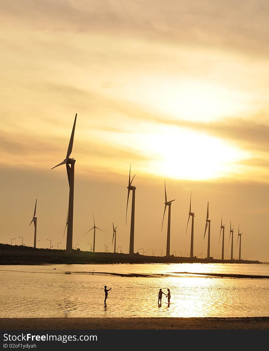 A golden sunset at the wind-power station. A golden sunset at the wind-power station