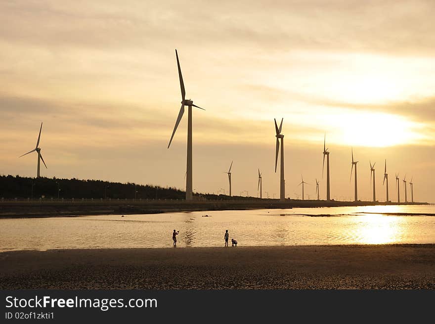 A golden sunset at the wind-power station. A golden sunset at the wind-power station