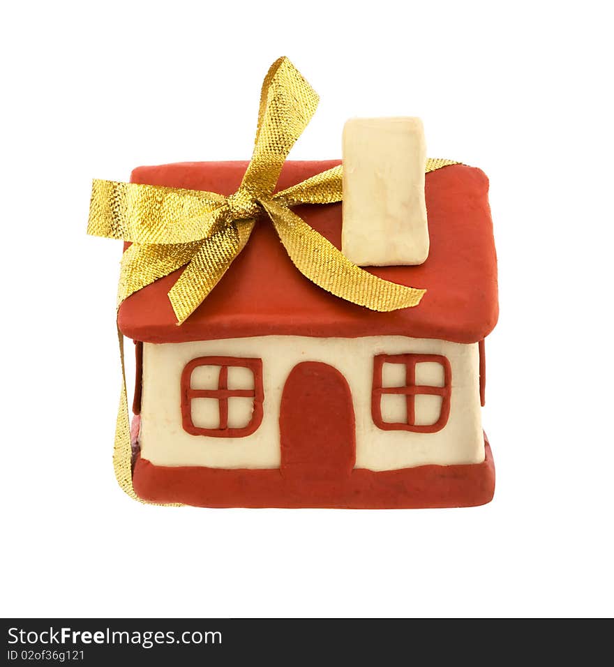 Plasticine house with a bow - the concept of buying