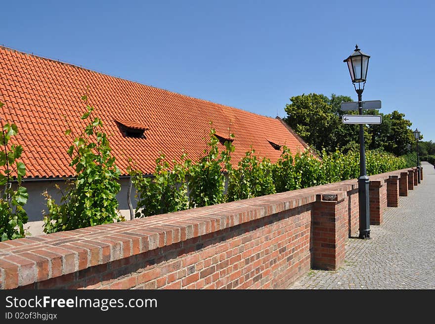 Orange roof and blank signpost