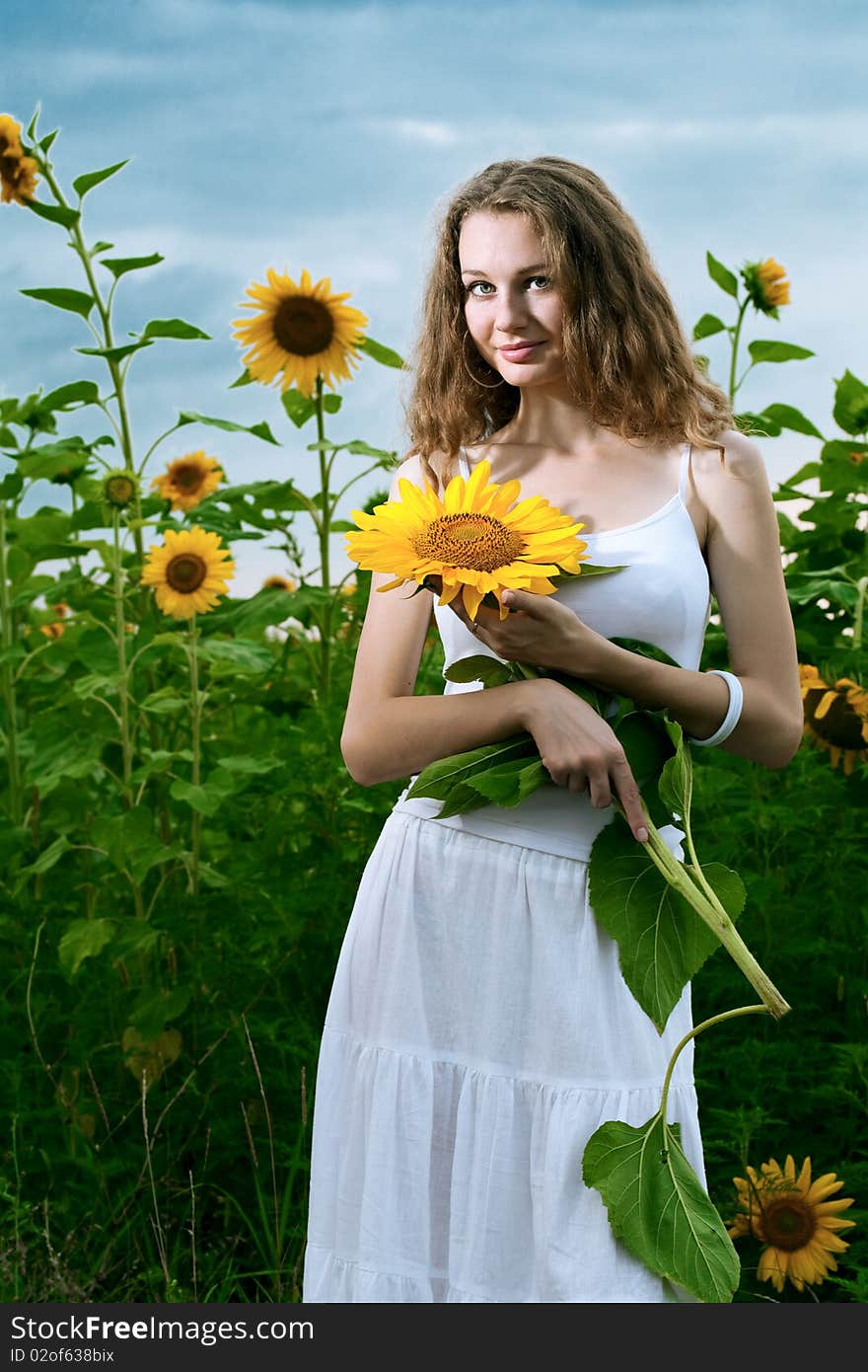 Beauty woman in sunflower field