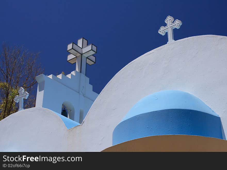 Greek church under blue sky in summer