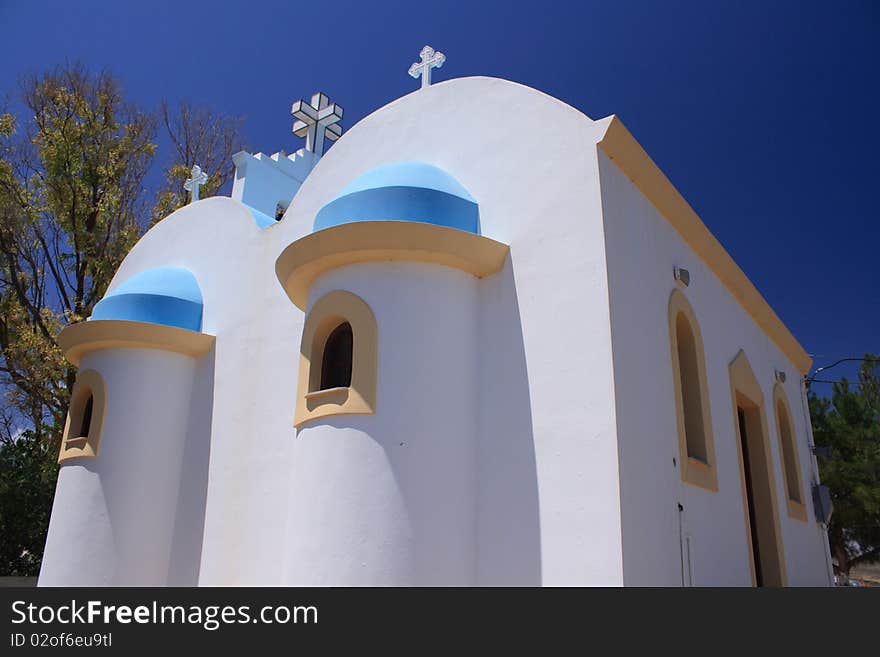 Greek church in summer under blue sky