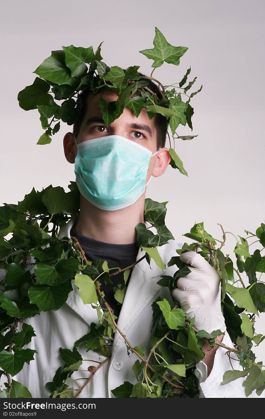 Doctor standing with medic grass around him. Doctor standing with medic grass around him