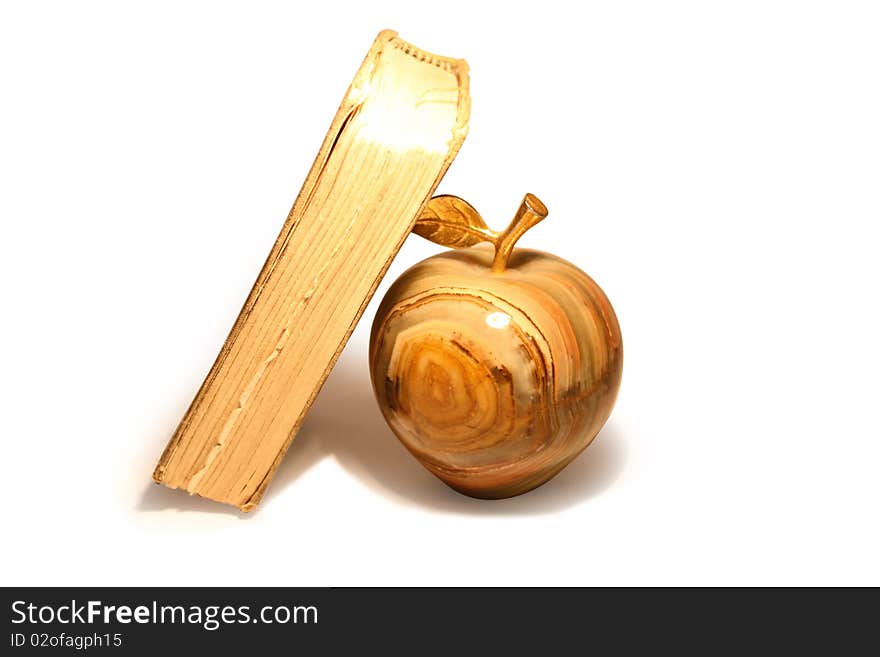 Apple from a marble and beads on a light background. Apple from a marble and beads on a light background