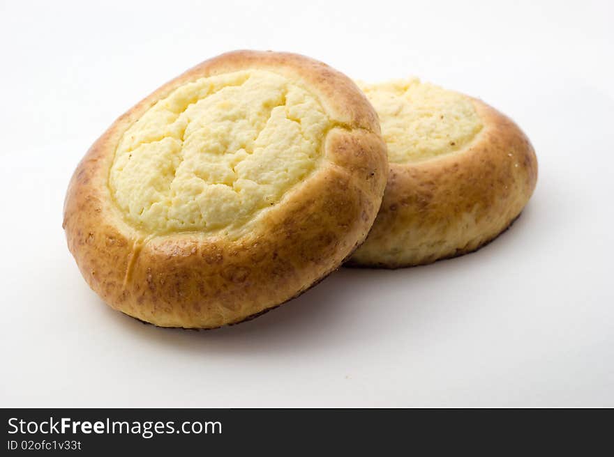 Sweet buns with cheese on white background