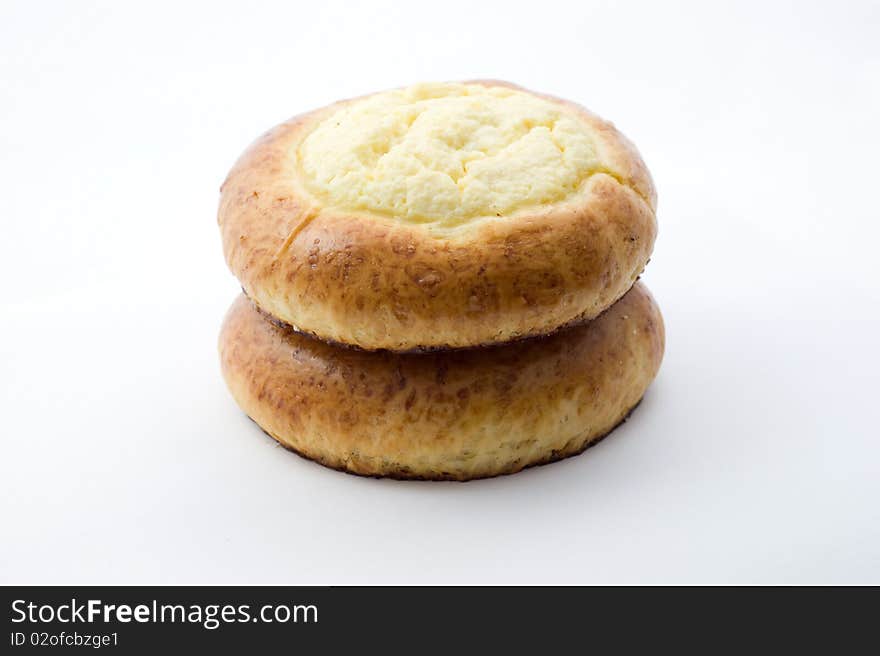 Sweet buns with cheese on white background