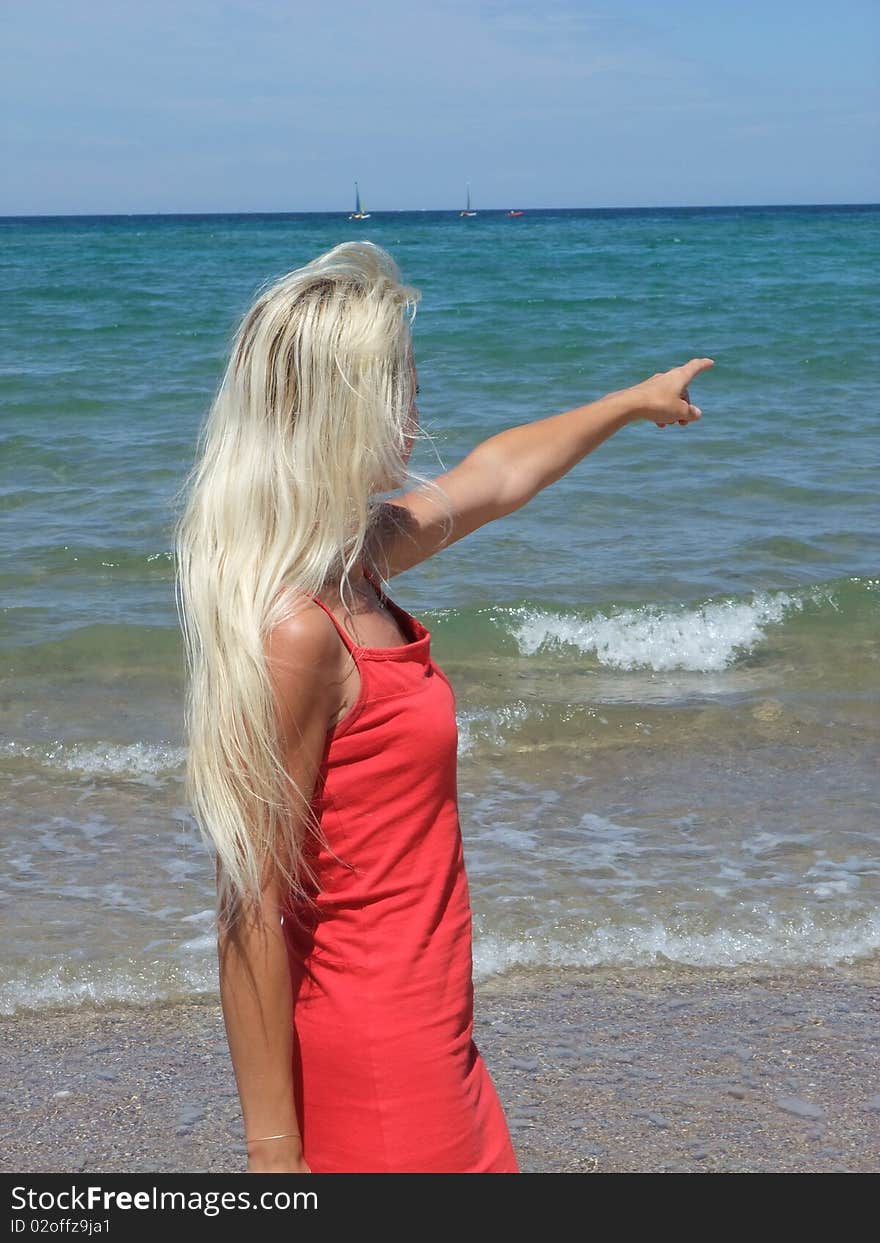 Woman at beach on blue sky