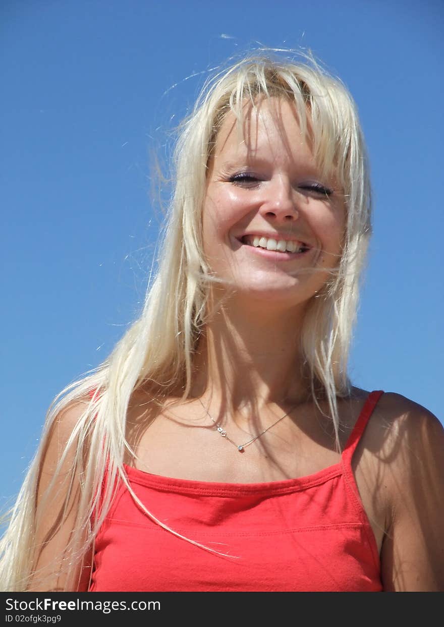 Woman at beach on blue sky