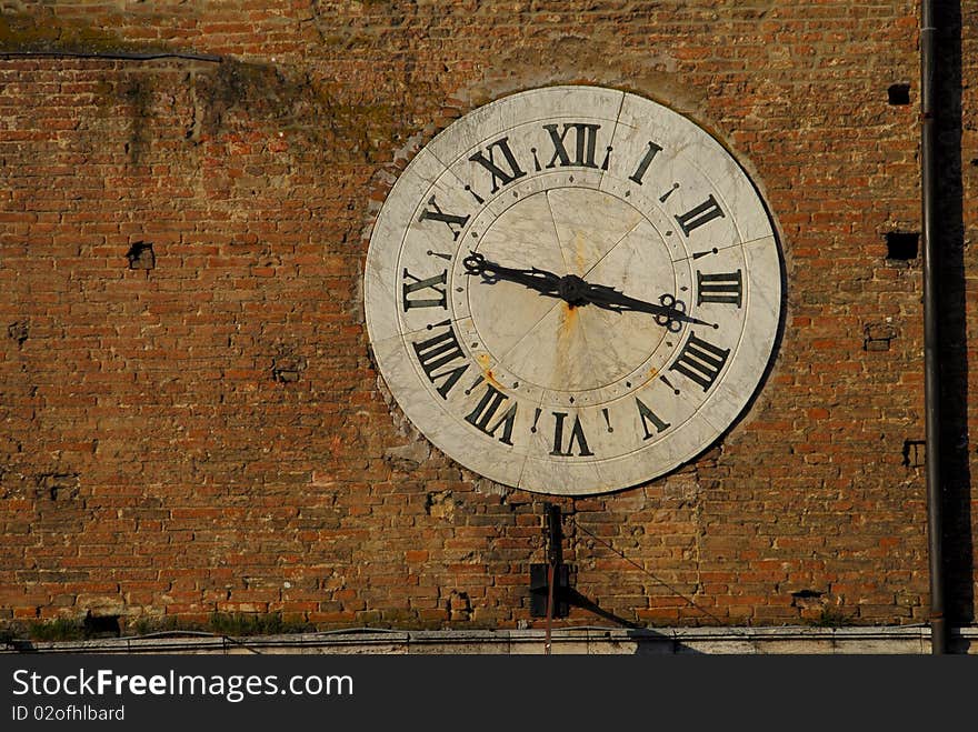 Antique clock in Siena, Italy