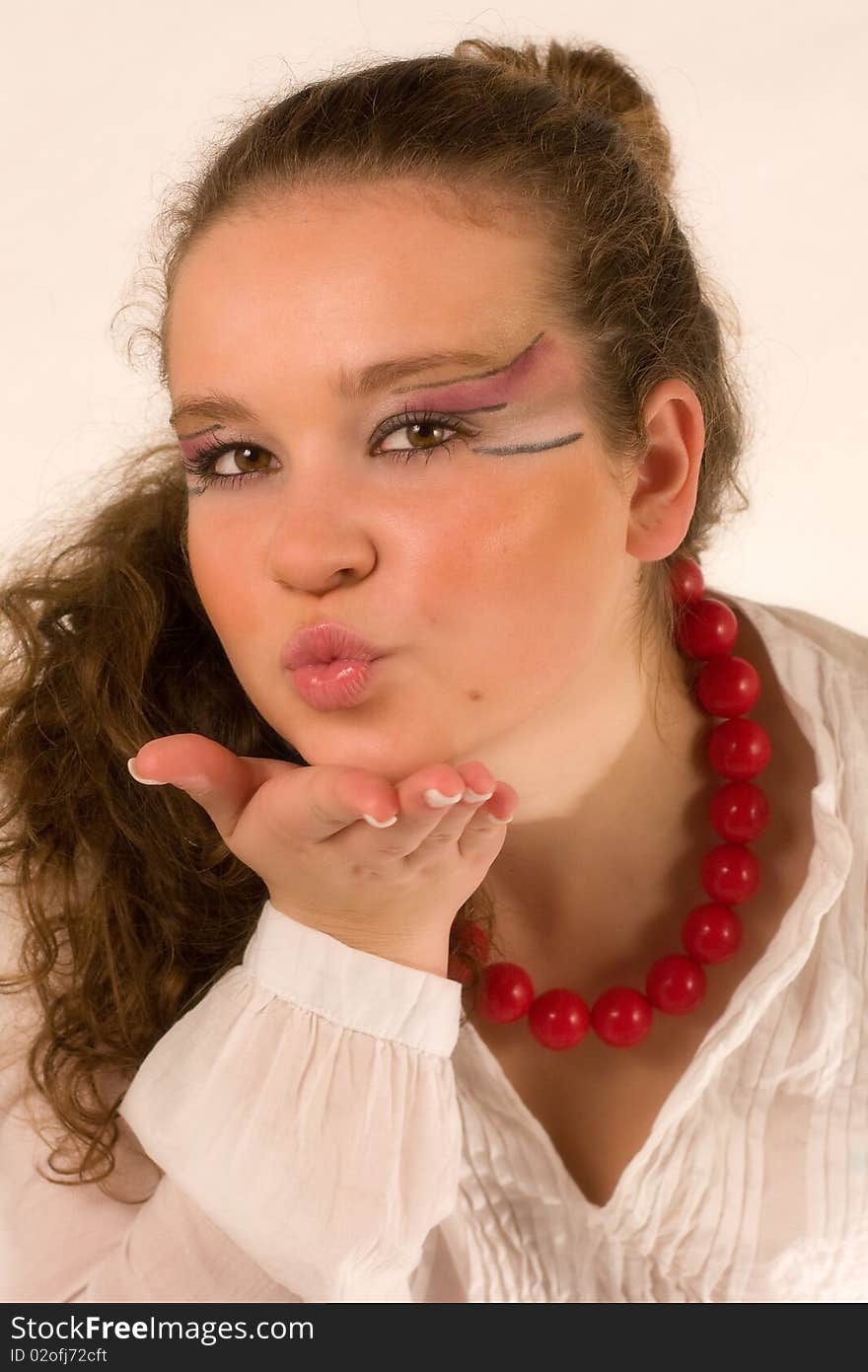 Beautiful woman sending a kiss