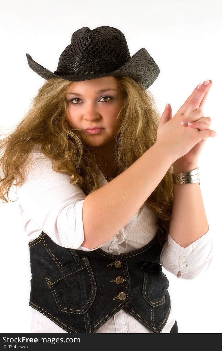 Beautiful western girl with fingers in the shape of gun