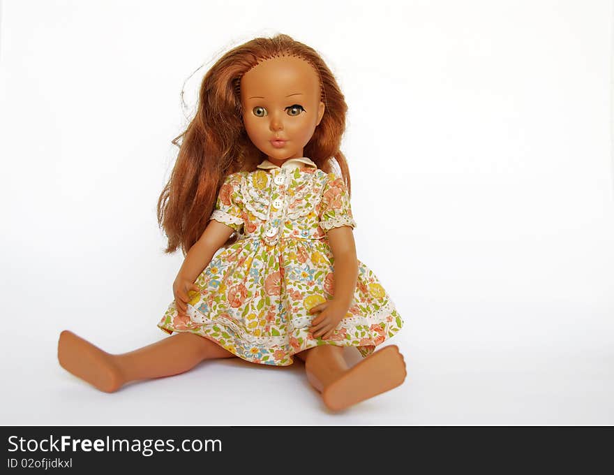 Old doll with red hair