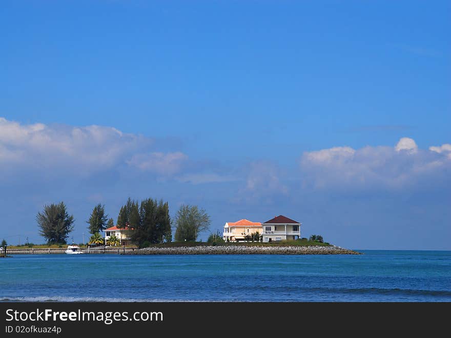 Photo of houses on man-made island facing melacca straits. Photo of houses on man-made island facing melacca straits