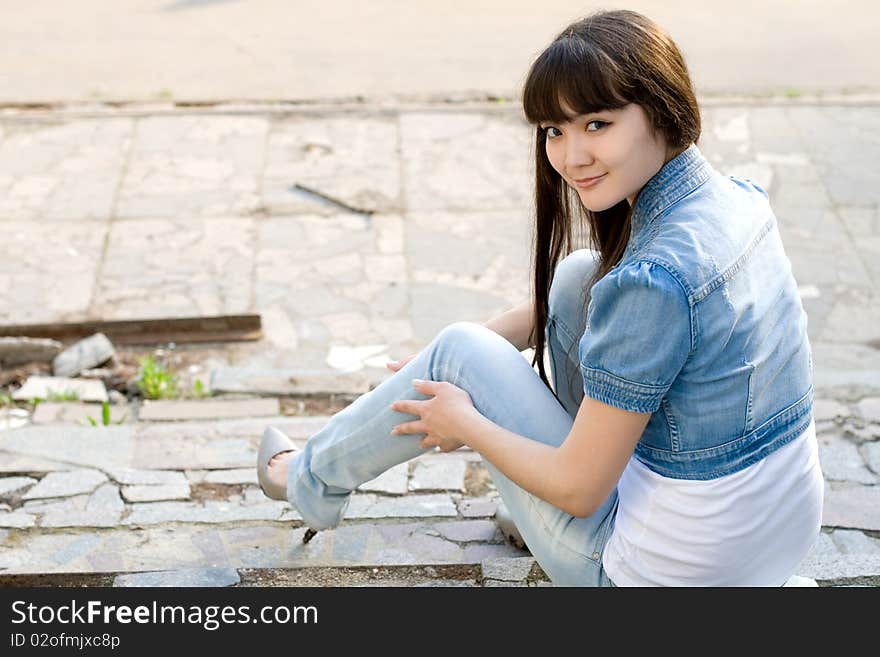 Girl sitting on stairs