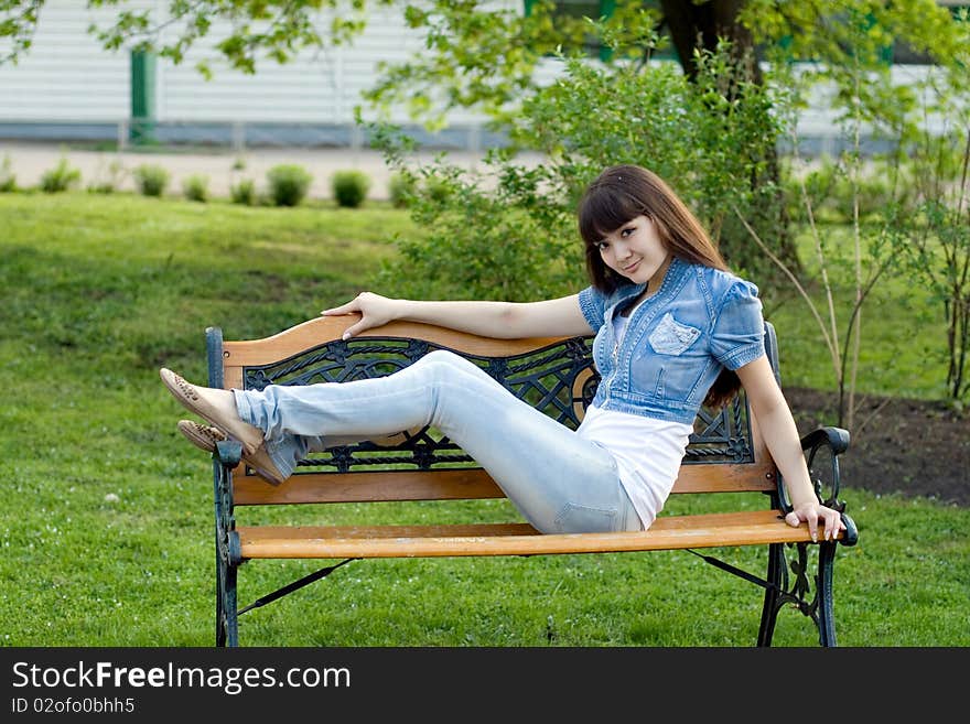 Girl lying on bench