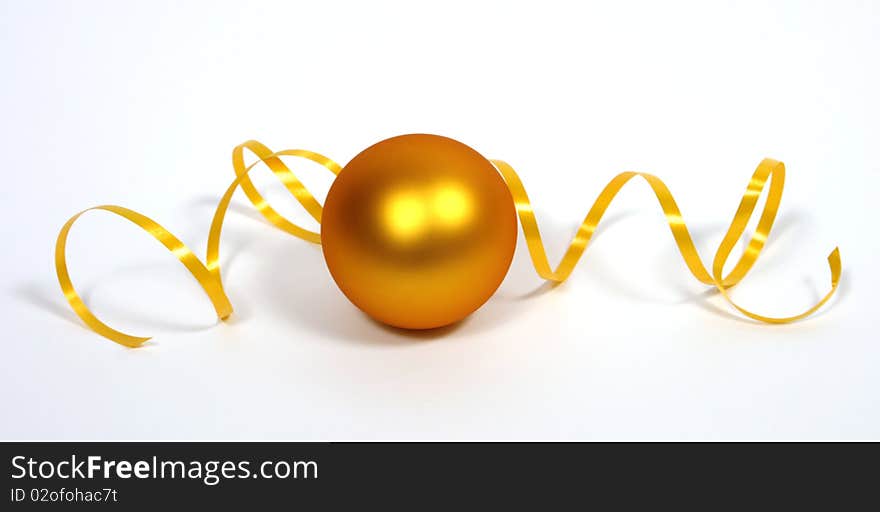 Yellow bauble with the yellow ribbon on the white background. Yellow bauble with the yellow ribbon on the white background