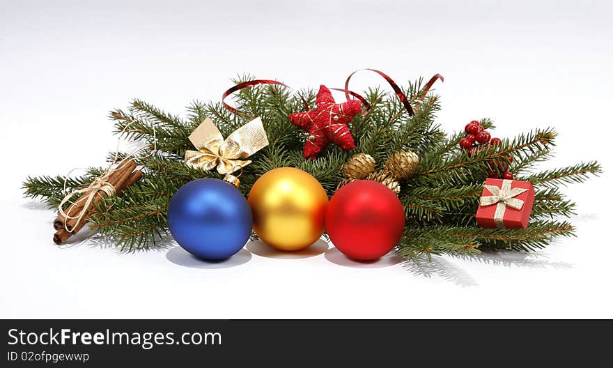 Christmas decoration with the twigs of the spruce and baubles