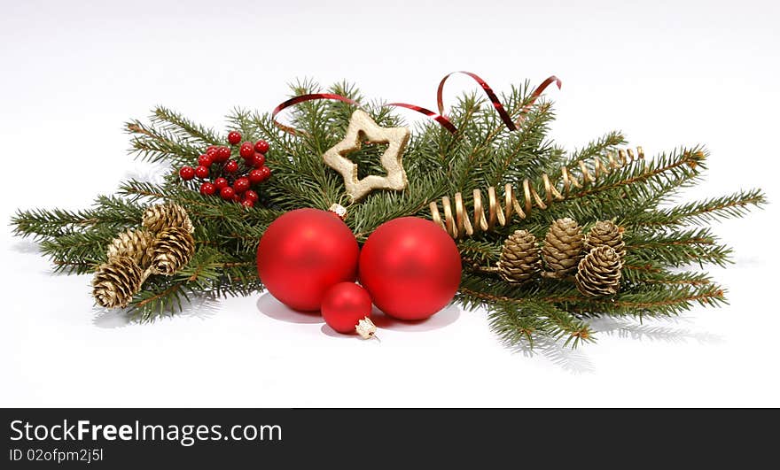 Christmas decoration with the twigs of the spruce and baubles