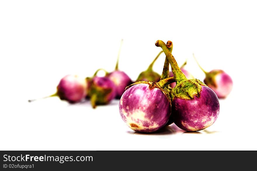 Group of small Egg-plants. Aubergine. Isolated over white.