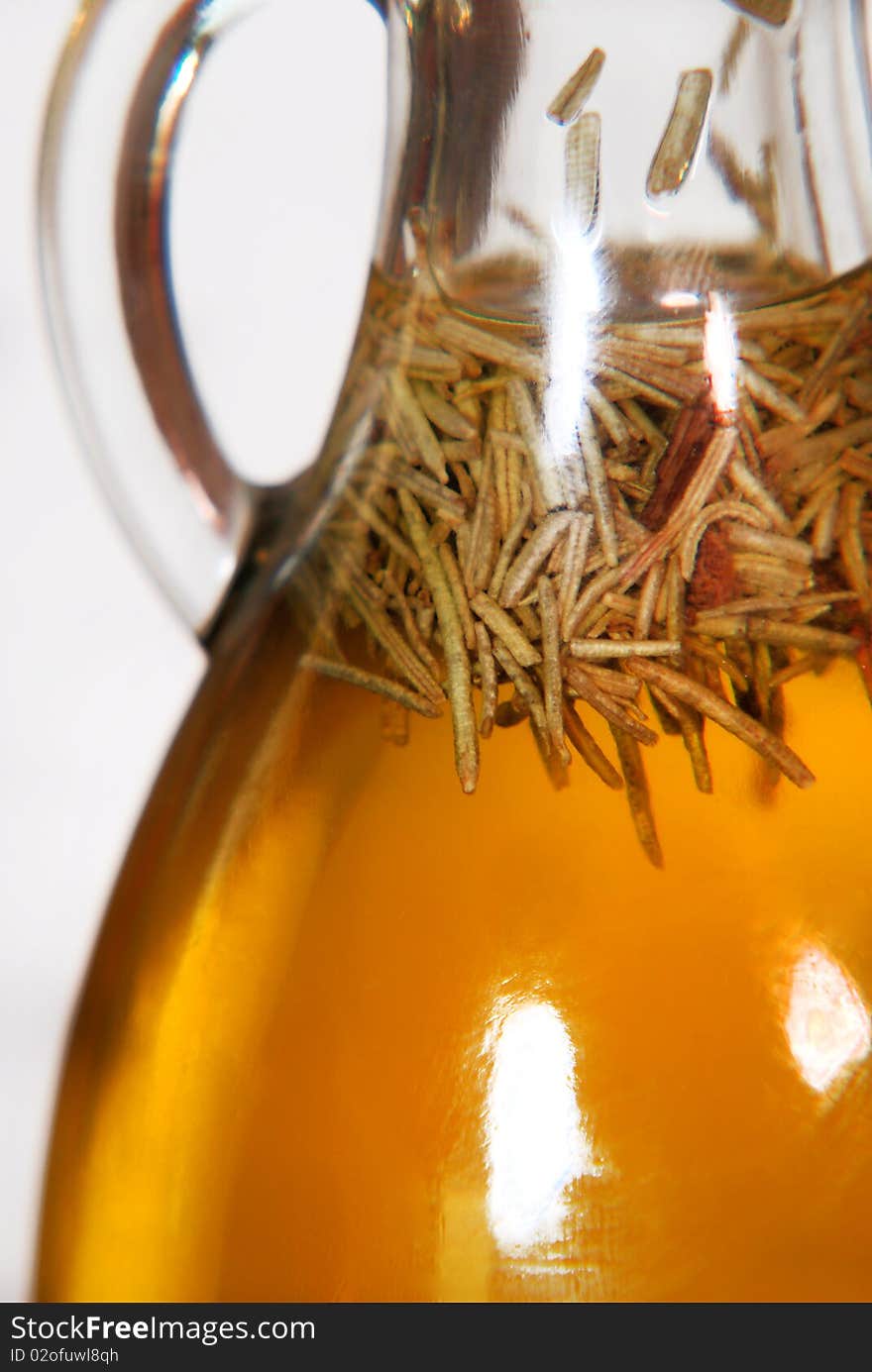 Close up of a special type of bottle containing delicious and healthy olive oil. Close up of a special type of bottle containing delicious and healthy olive oil