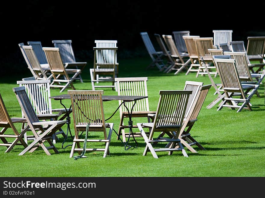 Deckchairs scattered on a lawn