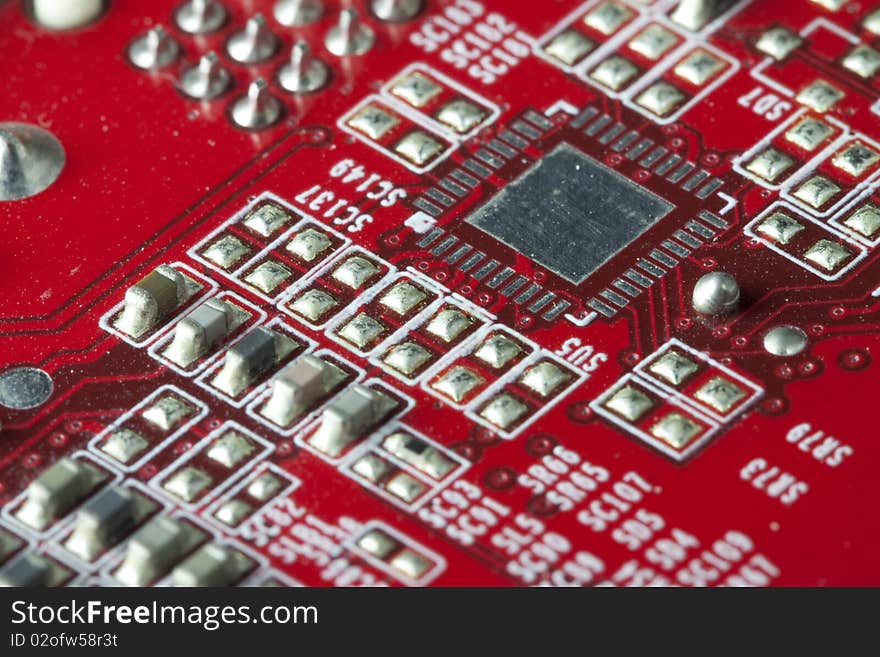 Red electronic circuit close-up