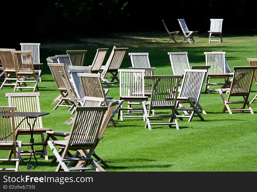 Deckchairs scattered on a lawn