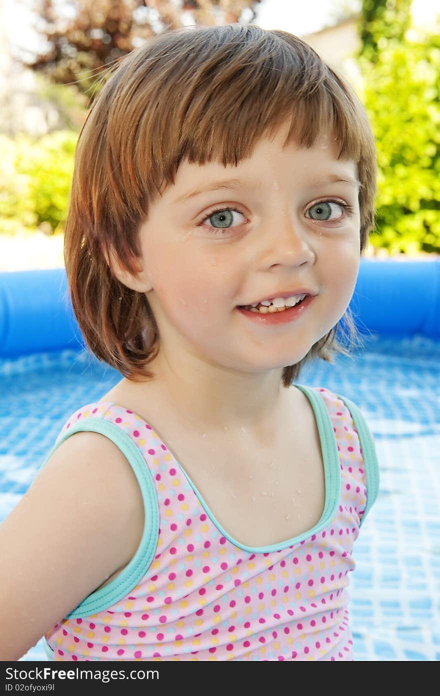 Portrait of little girl in basin